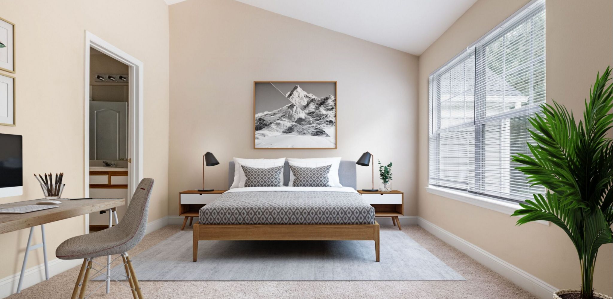 Hawthorne at the Pines well-lit bedroom with a large window, featuring a work desk, a framed mountain print above the bed, and a green potted plant